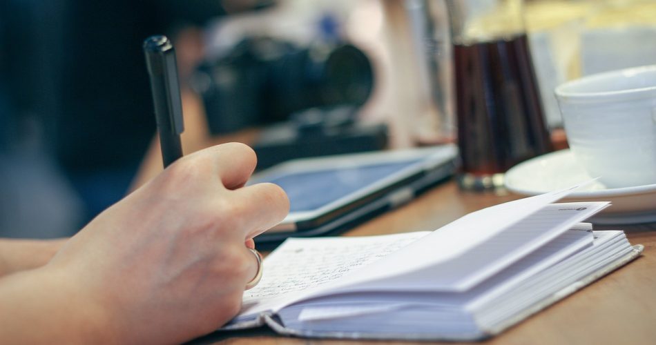 Writing in a notebok
